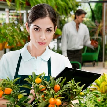 Portrait of a woman in a greenhouse