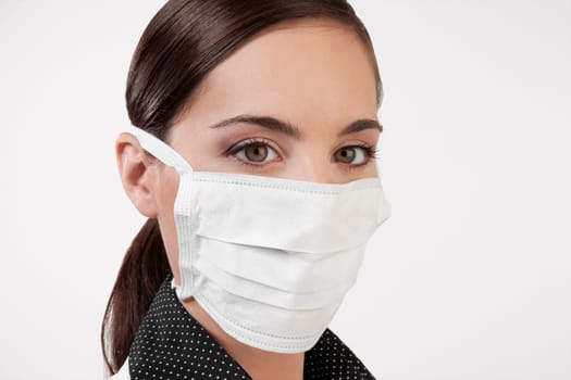 Female doctor wearing a flu mask