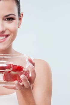 Woman holding a bowl of rose petals