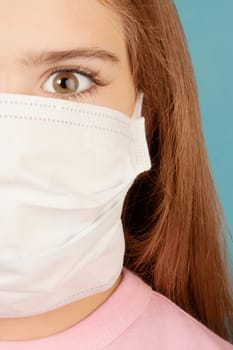 Portrait of a girl wearing a flu mask