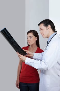 Doctor explaining x_ray report to a patient