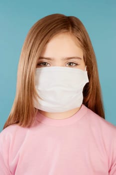 Portrait of a girl wearing a flu mask