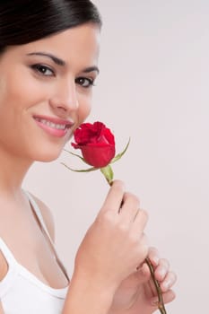 Portrait of a woman holding a rose