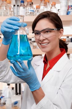 Female doctor holding a conical flask in a laboratory