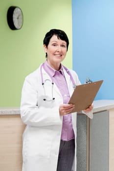 Female doctor holding a clipboard