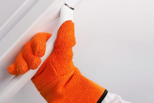 Doctor holding the handle of a refrigerator in a lab