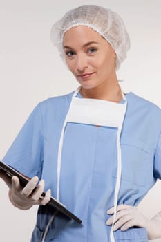 Female nurse holding a clipboard
