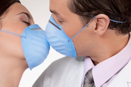 Doctors wearing flu masks and romancing