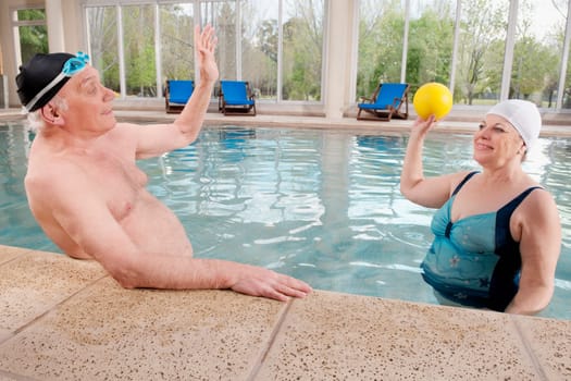 Couple playing in a swimming pool