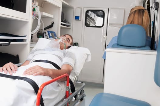 Patient with a female nurse in an ambulance