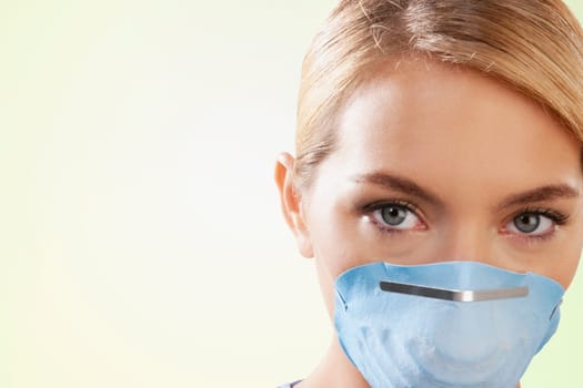 Female nurse wearing a flu mask
