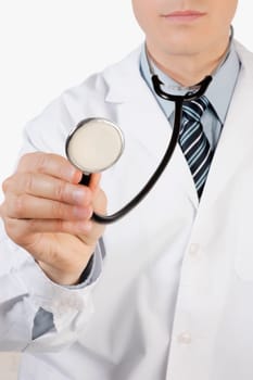 Close_up of a doctor holding a stethoscope