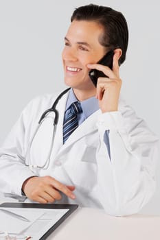 Doctor talking on a mobile phone