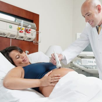 Pregnant woman going through an ultrasound scan