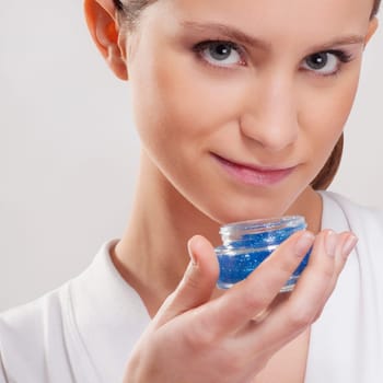 Portrait of a woman smelling aroma gel