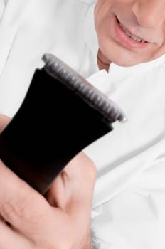Vet holding an electric razor