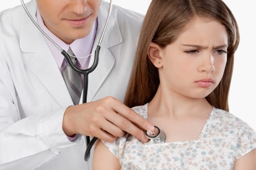 Doctor examining a girl with a stethoscope