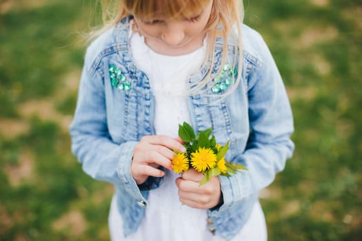 Small girl is holding Small girl is holding a bouquet with yellow flowers. High quality photoa bouquet with yellow flowers. High quality photo
