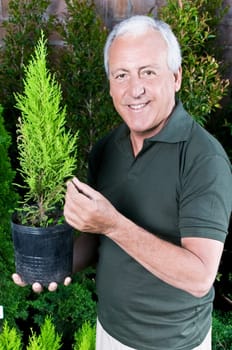 Man holding a potted plant