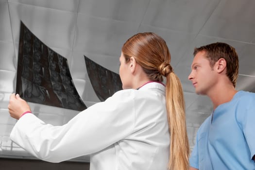 Doctors examining an X_Ray report
