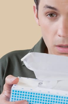 Man holding a tissue paper box