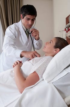 Doctor examining a woman