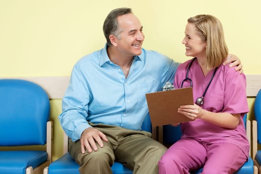 Female nurse showing a medical report to a patient