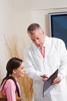 Dentist discussing with his patient