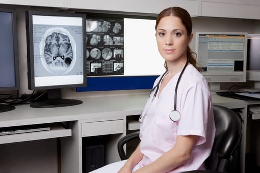 Portrait of a female doctor with MRI report