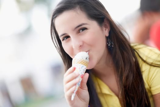 Portrait of a teenage girl eating an ice cream