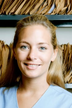 Female doctor in a record room