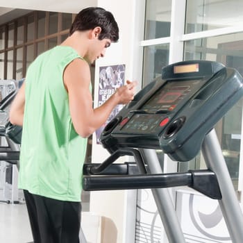 Man standing on a treadmill