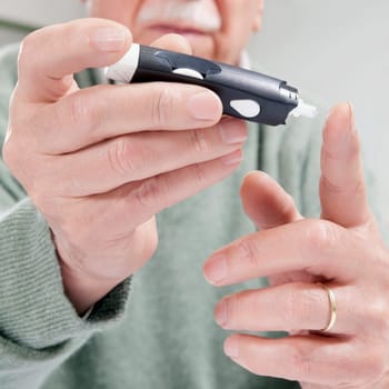Man testing his blood sugar level