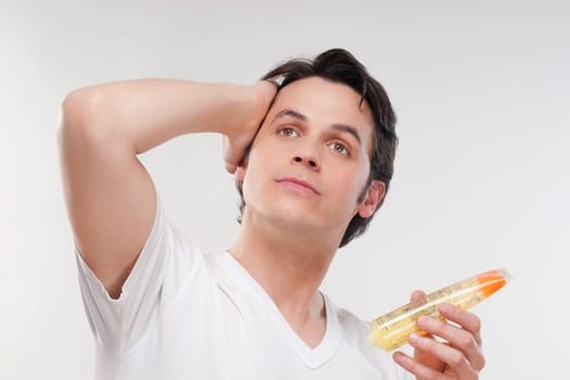 Man applying gel on his hair