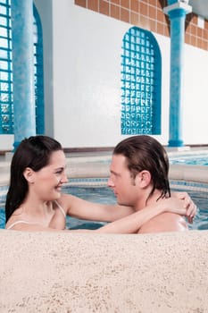 Couple romancing in a hot tub