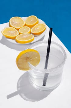 Close_up of a glass of lemonade with lemon slices