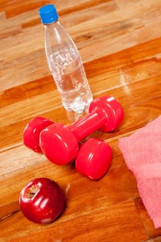 Water bottle with an apple and dumbbells