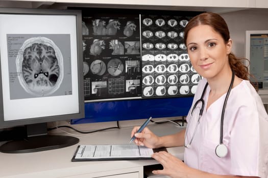 Portrait of a female doctor with MRI report