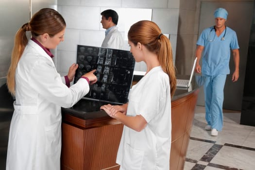Two female doctors examining an X_Ray report