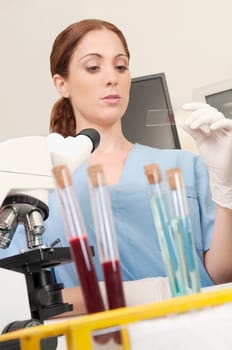 Female lab technician analyzing a sample in a laboratory