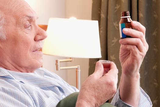 Close_up of a man taking medicine