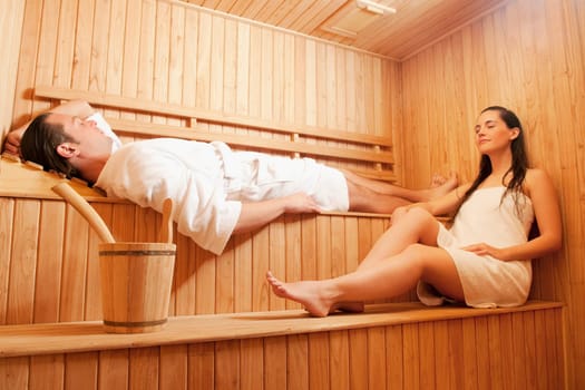 Couple taking a sauna bath