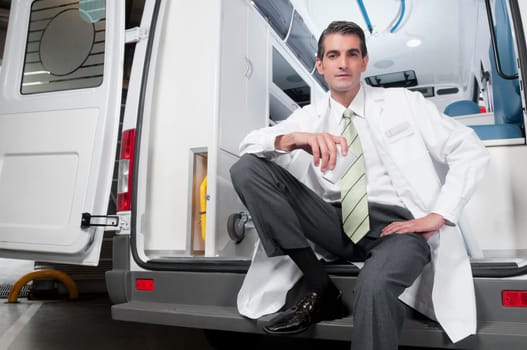 Doctor sitting in an ambulance