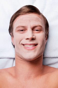 Man with face pack on his face
