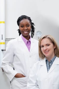 Portrait of two female doctors smiling in a laboratory