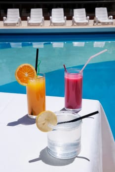 Close_up of assorted drinks at the poolside