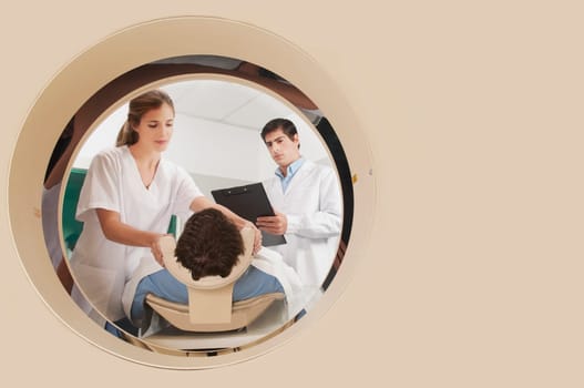 Doctor and nurse preparing a patient for MRI scan