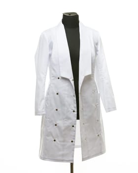 Medical gown hanging on a mannequin, isolated on white background