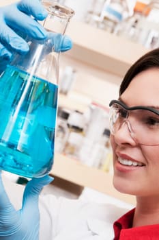 Female doctor holding a conical flask in a laboratory