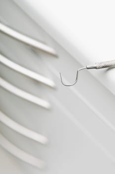 Close_up of a dental scaler in an examination room